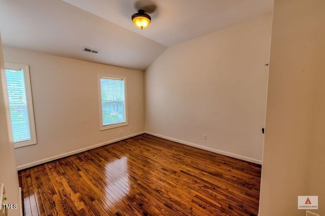 332 Bridgegate Dr, Cary, NC 27519 - spare room with wood finished floors and vaulted ceiling