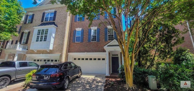 332 Bridgegate Dr, Cary, NC 27519 - view of front of house featuring an attached garage, driveway, and brick siding