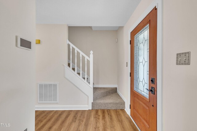 4309 Birmingham Way, Raleigh, NC 27604 - foyer entrance featuring stairway and wood finished floors