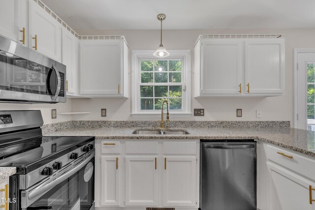 4309 Birmingham Way, Raleigh, NC 27604 - kitchen featuring stainless steel appliances, white cabinetry, light stone countertops, and pendant lighting