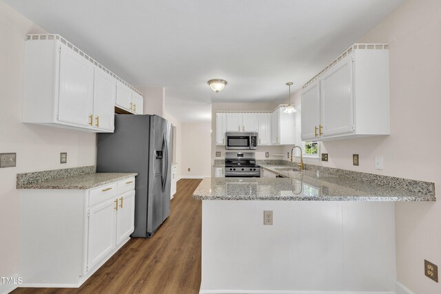 4309 Birmingham Way, Raleigh, NC 27604 - kitchen with appliances with stainless steel finishes, wood finished floors, a peninsula, light stone counters, and white cabinets