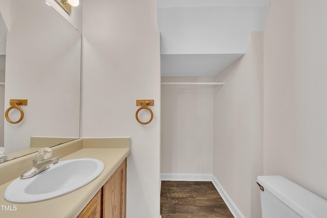4309 Birmingham Way, Raleigh, NC 27604 - bathroom featuring wood finished floors, vanity, and a textured ceiling