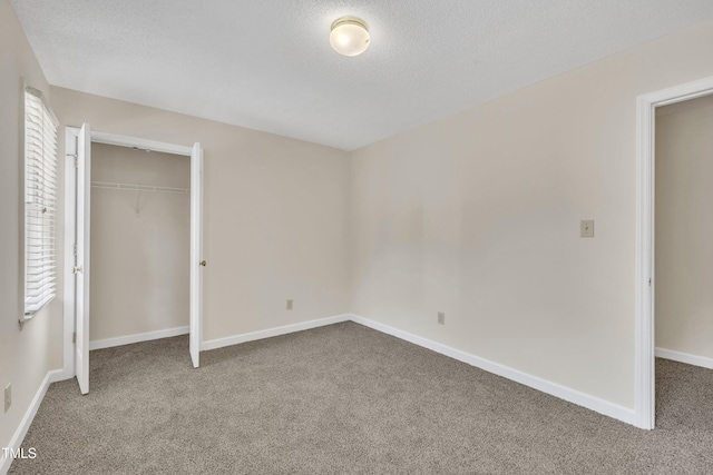4309 Birmingham Way, Raleigh, NC 27604 - unfurnished bedroom featuring carpet, a closet, and a textured ceiling