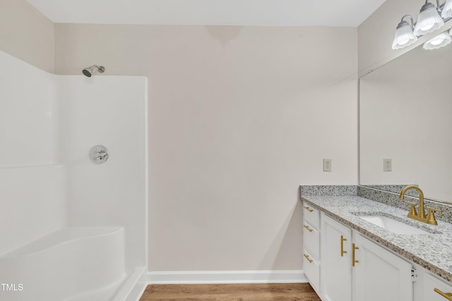 4309 Birmingham Way, Raleigh, NC 27604 - full bathroom with vanity, wood finished floors, and a shower