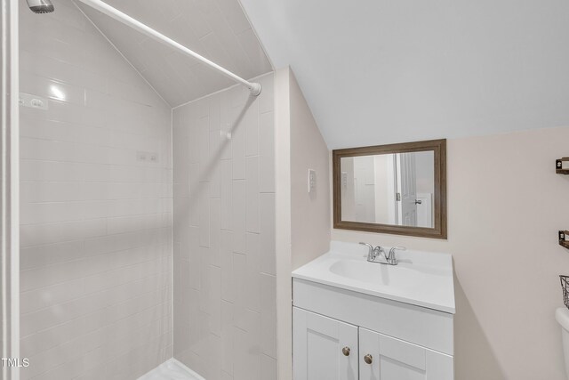 4309 Birmingham Way, Raleigh, NC 27604 - bathroom with vaulted ceiling, tiled shower, and vanity
