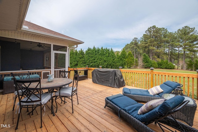 169 Skippers Lndg, Manson, NC 27553 - wooden deck featuring outdoor dining area, a grill, a sunroom, and a ceiling fan