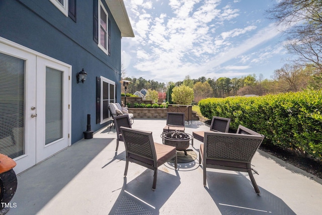169 Skippers Lndg, Manson, NC 27553 - view of patio featuring an outdoor fire pit and french doors