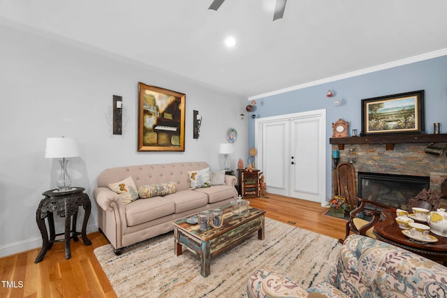 169 Skippers Lndg, Manson, NC 27553 - living area with ornamental molding, ceiling fan, wood finished floors, and a stone fireplace