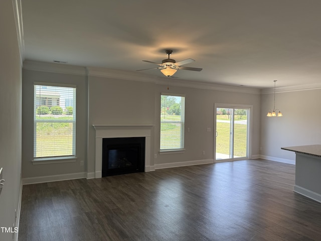 14 Gallop Rein Cir, Benson, NC 27504 - unfurnished living room with dark wood-style floors, a fireplace, a ceiling fan, ornamental molding, and a chandelier