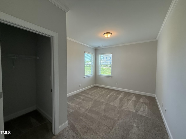 14 Gallop Rein Cir, Benson, NC 27504 - unfurnished bedroom featuring crown molding, carpet flooring, a spacious closet, and a closet