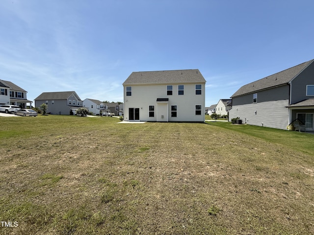 14 Gallop Rein Cir, Benson, NC 27504 - back of house featuring a residential view, a lawn, and a patio