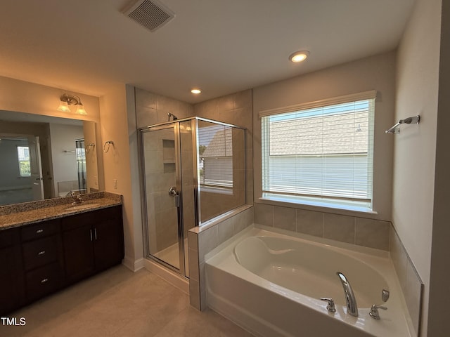 14 Gallop Rein Cir, Benson, NC 27504 - bathroom featuring a bath, vanity, a shower stall, tile patterned flooring, and recessed lighting
