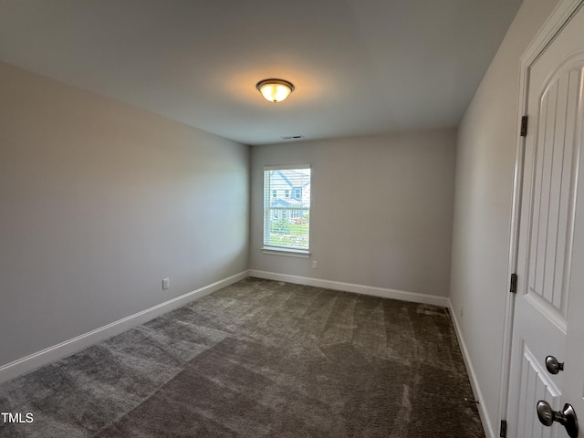 14 Gallop Rein Cir, Benson, NC 27504 - empty room with dark carpet and baseboards