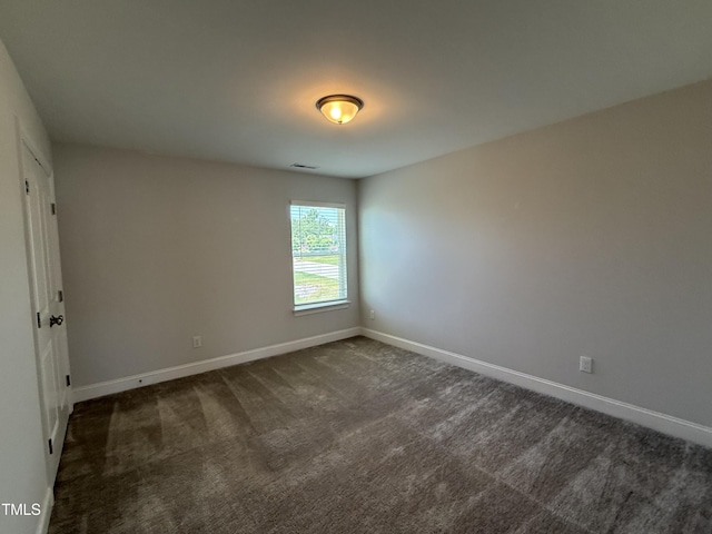 14 Gallop Rein Cir, Benson, NC 27504 - spare room featuring baseboards and dark colored carpet