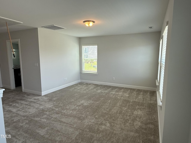 14 Gallop Rein Cir, Benson, NC 27504 - carpeted empty room with attic access and baseboards