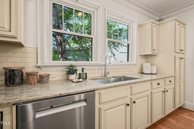 211 W Trinity Ave, Durham, NC 27701 - kitchen with stainless steel dishwasher, cream cabinets, ornamental molding, light wood finished floors, and tasteful backsplash