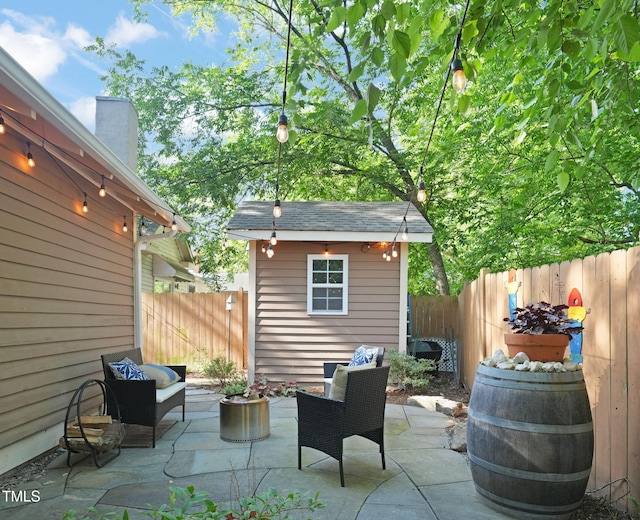 211 W Trinity Ave, Durham, NC 27701 - fenced backyard with a patio area and a storage unit