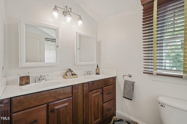 211 W Trinity Ave, Durham, NC 27701 - full bathroom with vaulted ceiling and double vanity