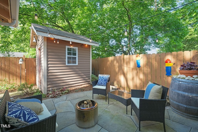 211 W Trinity Ave, Durham, NC 27701 - fenced backyard with an outdoor structure and a patio area