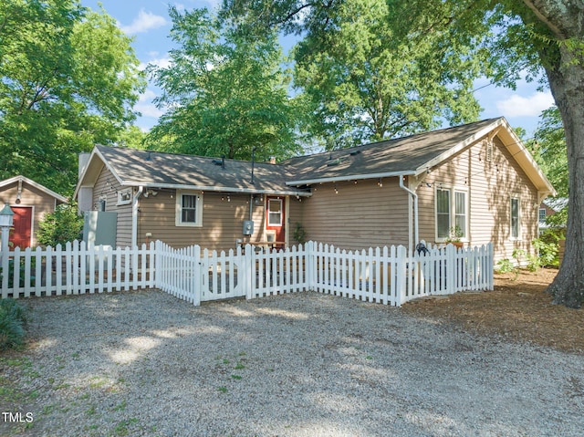 211 W Trinity Ave, Durham, NC 27701 - ranch-style house featuring a fenced front yard and a shingled roof