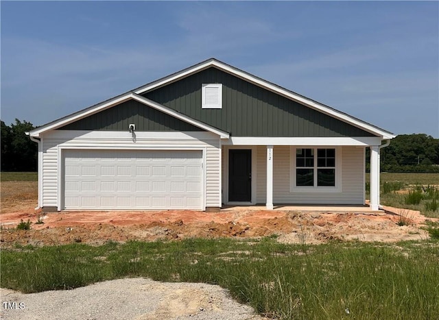 112 Dalton Dr, Lumber Bridge, NC 28357 - view of front of home featuring a porch and an attached garage
