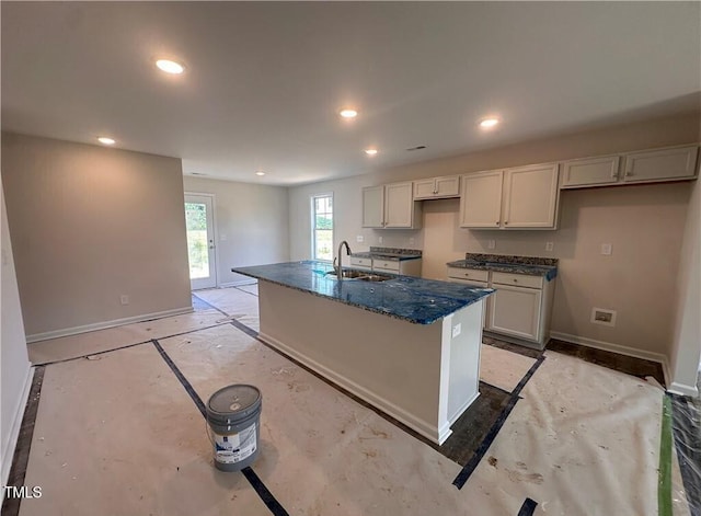 112 Dalton Dr, Lumber Bridge, NC 28357 - kitchen featuring a center island with sink, recessed lighting, and dark stone countertops