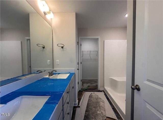 112 Dalton Dr, Lumber Bridge, NC 28357 - full bathroom with double vanity and a walk in closet