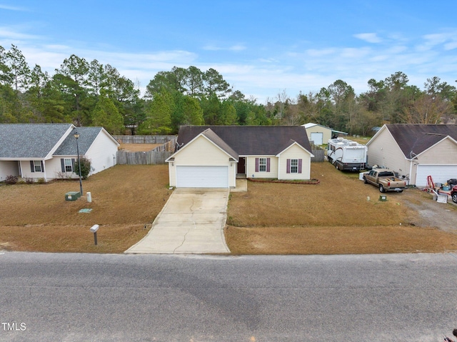 205 Driftwood Ln, Raeford, NC 28376 - ranch-style home featuring concrete driveway and a garage