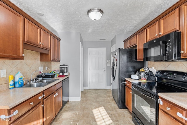 205 Driftwood Ln, Raeford, NC 28376 - kitchen featuring black appliances, brown cabinets, light countertops, and tasteful backsplash
