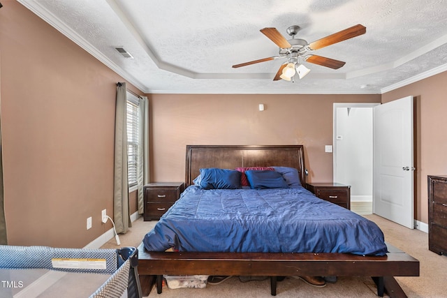 205 Driftwood Ln, Raeford, NC 28376 - bedroom with a tray ceiling, a textured ceiling, light colored carpet, a ceiling fan, and ornamental molding