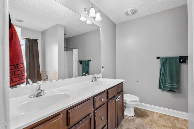 205 Driftwood Ln, Raeford, NC 28376 - full bathroom featuring double vanity, a textured ceiling, and curtained shower