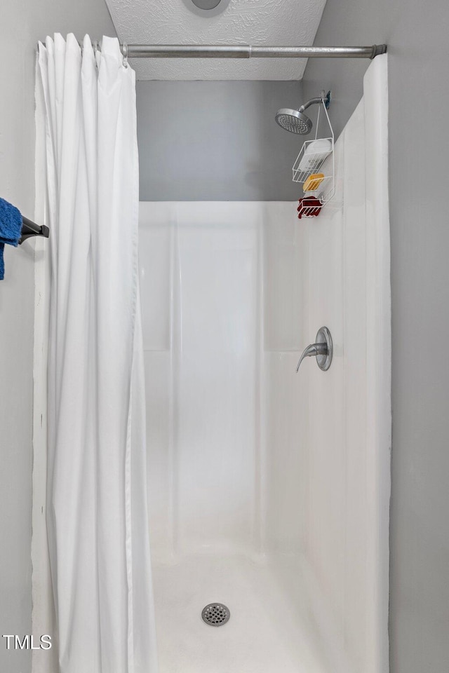 205 Driftwood Ln, Raeford, NC 28376 - full bath with curtained shower and a textured ceiling