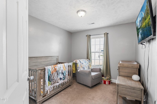 205 Driftwood Ln, Raeford, NC 28376 - bedroom featuring carpet floors, a crib, and a textured ceiling