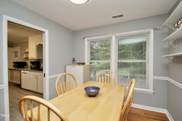 3812 Vesta Dr, Raleigh, NC 27603 - dining room featuring light wood-type flooring and baseboards