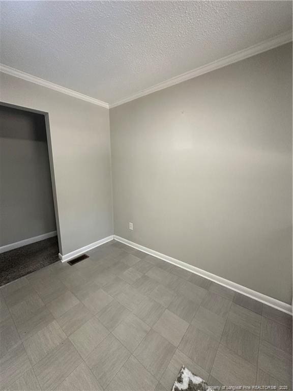 3513 Greenwood Dr, Fayetteville, NC 28311 - unfurnished bedroom with crown molding, a textured ceiling, and tile patterned floors