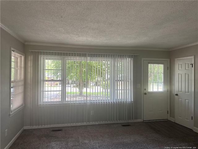 3513 Greenwood Dr, Fayetteville, NC 28311 - carpeted foyer featuring healthy amount of natural light, a textured ceiling, and crown molding