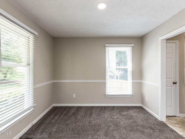 23 Joci Ct, Durham, NC 27704 - carpeted spare room with a textured ceiling
