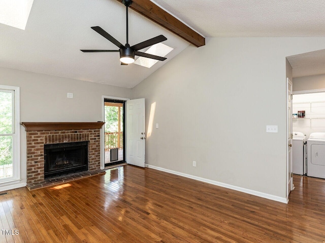 23 Joci Ct, Durham, NC 27704 - unfurnished living room with independent washer and dryer, hardwood / wood-style flooring, a ceiling fan, and a skylight