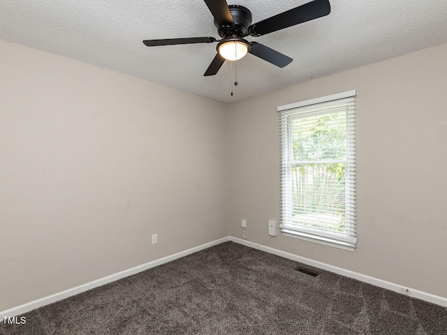 23 Joci Ct, Durham, NC 27704 - empty room featuring dark carpet, a textured ceiling, and ceiling fan