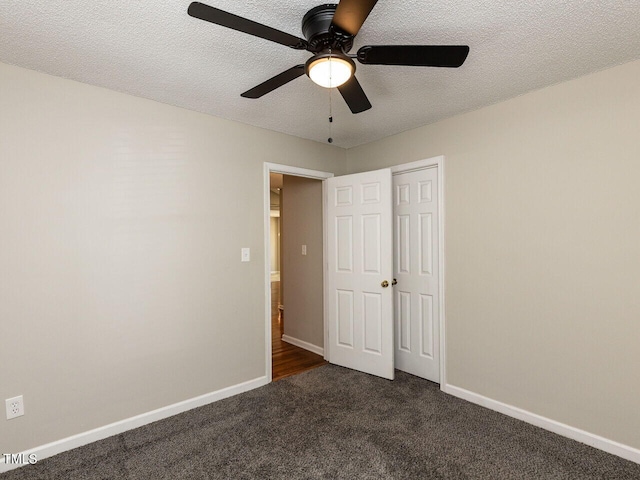 23 Joci Ct, Durham, NC 27704 - unfurnished bedroom with dark carpet, a textured ceiling, a ceiling fan, and a closet