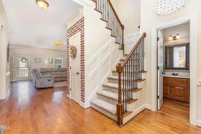 114 Boone Trl, Garner, NC 27529 - staircase featuring wood finished floors and crown molding