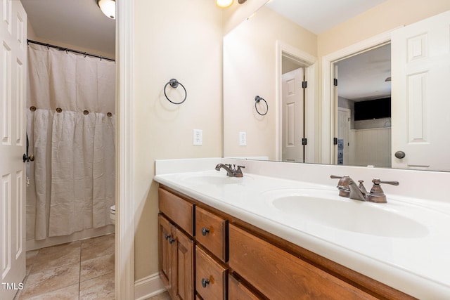 114 Boone Trl, Garner, NC 27529 - full bathroom featuring double vanity and toilet