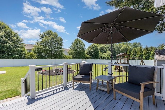 114 Boone Trl, Garner, NC 27529 - wooden deck with a playground and a fenced backyard