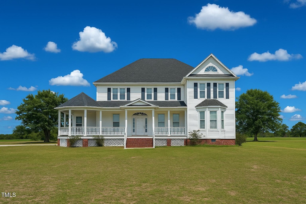 1768 Greens Bridge Rd, Garland, NC 28441 - view of front of property featuring covered porch, a front lawn, crawl space, and roof with shingles