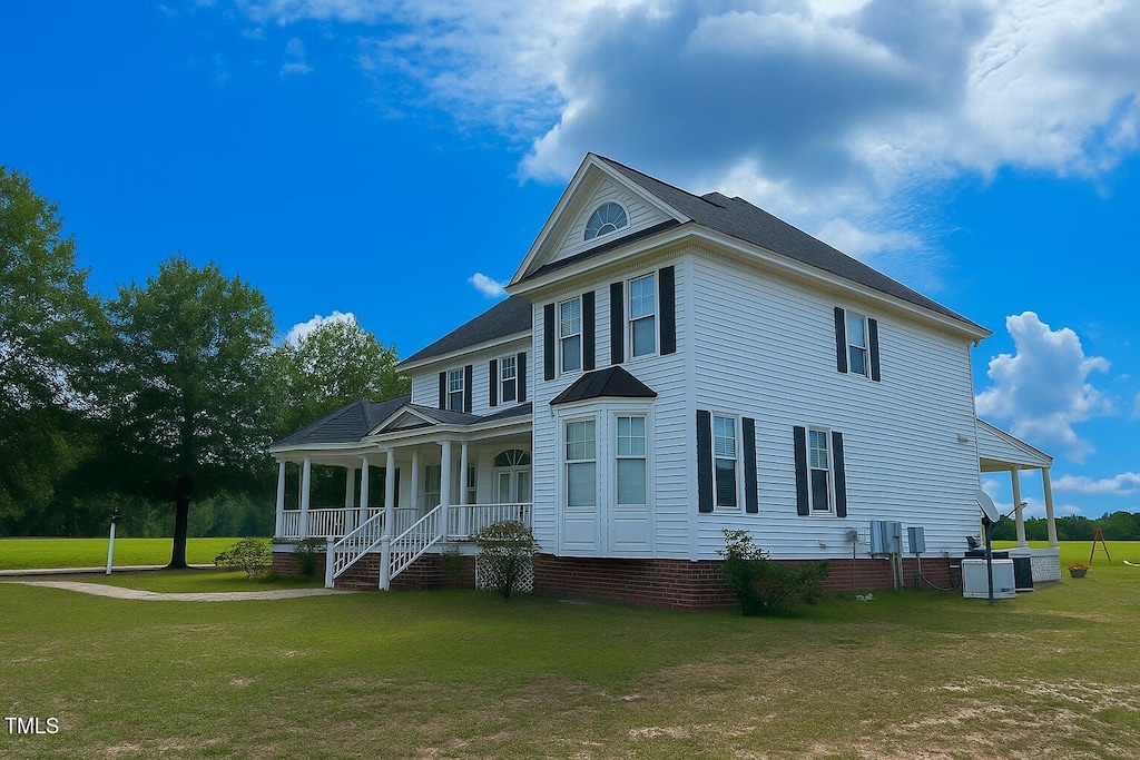1768 Greens Bridge Rd, Garland, NC 28441 - view of front of home with a porch and a front lawn
