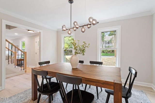 4006 New Yarmouth Way, Apex, NC 27502 - dining room with healthy amount of natural light, light wood finished floors, crown molding, and a chandelier
