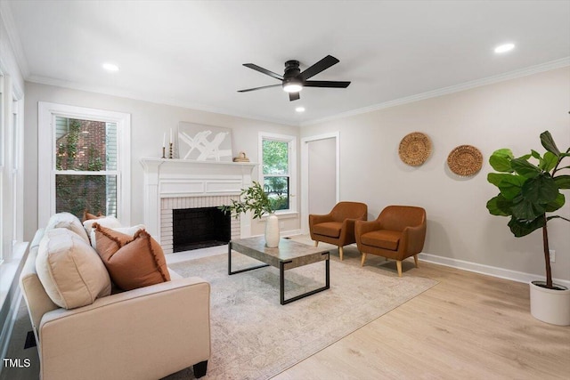 4006 New Yarmouth Way, Apex, NC 27502 - living room with light wood-style floors, ceiling fan, crown molding, a brick fireplace, and recessed lighting