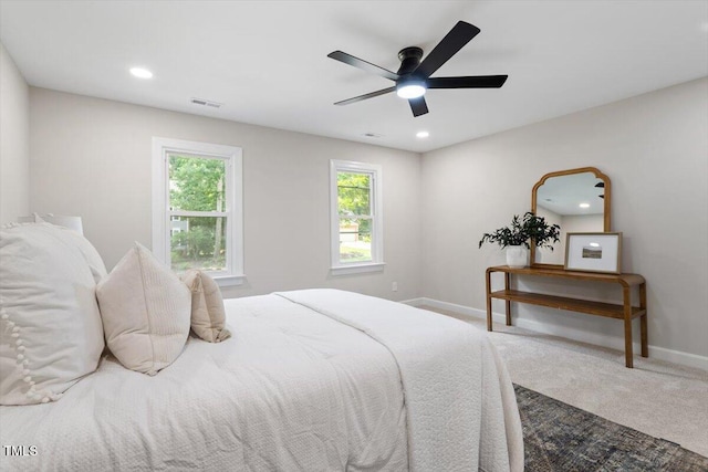 4006 New Yarmouth Way, Apex, NC 27502 - carpeted bedroom with multiple windows, a ceiling fan, and recessed lighting