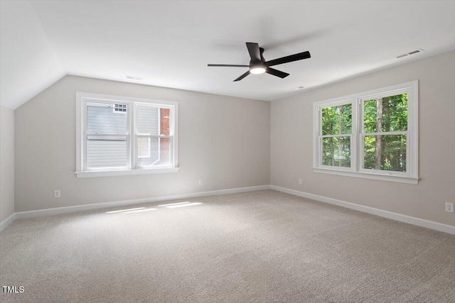 4006 New Yarmouth Way, Apex, NC 27502 - empty room with healthy amount of natural light, ceiling fan, light colored carpet, and vaulted ceiling