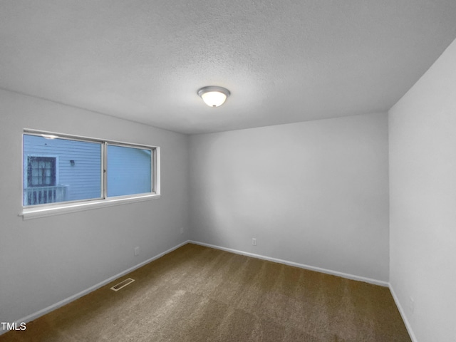 3721 Suffolk St, Durham, NC 27707 - unfurnished room featuring carpet floors and a textured ceiling